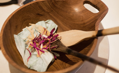Salad in wooden bowl.