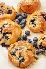 Fresh yeast buns with cheese and blueberries.