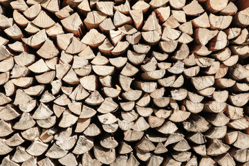 Neat stack of cut wood, textured background