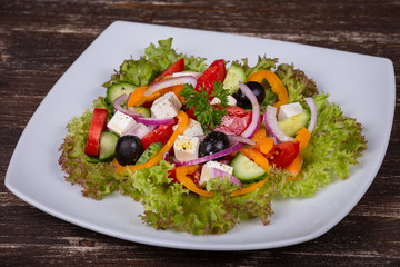 Fresh vegetable greek salad on the table