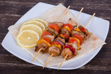 Tasty grilled meat and vegetables on skewer