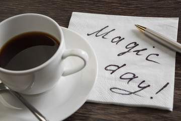 Coffee cup and napkin with message