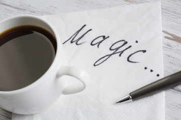 Coffee cup and napkin with message