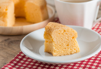 Sliced of Chiffon cake with cup coffee.