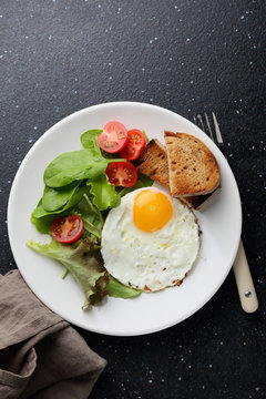 Breakfast egg with salad