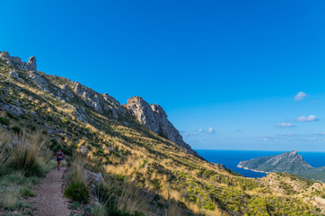 Female hiking in the mountains of Tramuntana, Mallorca, Baleares, Spain