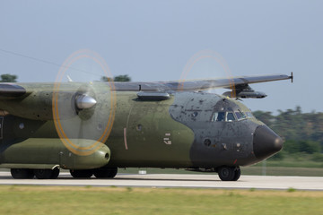 Military transport plane with propellor motion blur