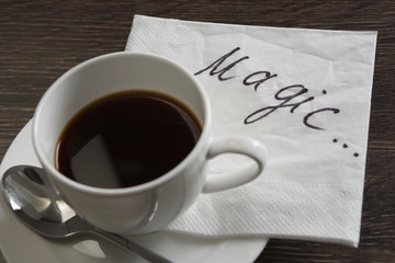 Coffee cup and napkin with message