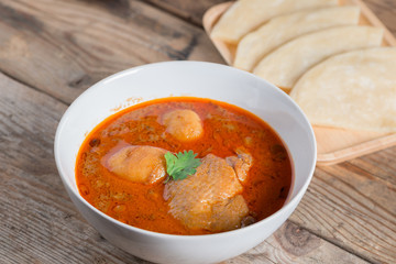 Chicken massaman curry with roti.