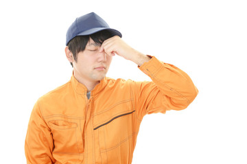 頭痛を訴える労働者