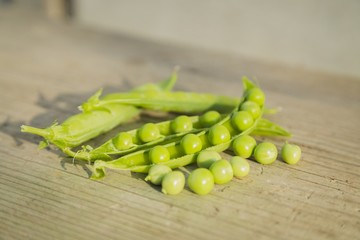 pea pods on wooden table