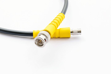 BNC connector jack with cable for video signal isolated on white background.