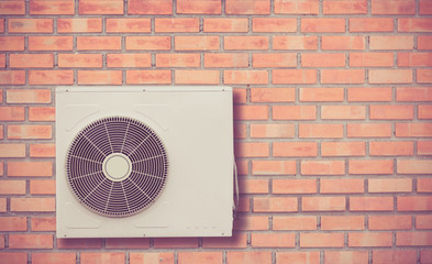 Outdoor Air Conditioner Fan Ventilation on the Brick Wall,Air compressor installation on the...