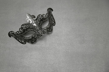 Fancy Vintage Festive Black mask on grey wooden background