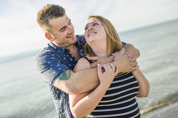 portrait of living young couple at the beach