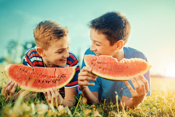  Children eating watermelon in the park