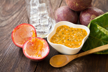 Fresh passion fruits on a wooden background