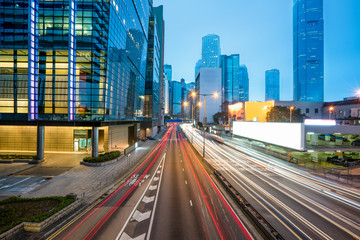Obraz premium blurred traffic in downtown district,hong kong,china.Chinese characters on road are all traffic roadmarking.