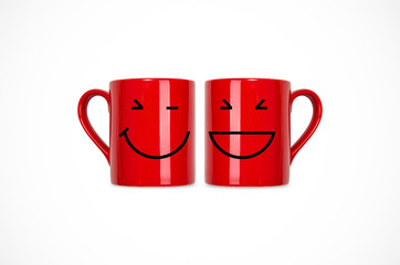 red coffee cup with smile.