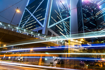 Fototapeta na wymiar blurred traffic in downtown district,hong kong,china.Chinese characters on road are all traffic roadmarking.