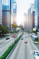blurred traffic in downtown district,hong kong,china.Chinese characters on road are all traffic roadmarking.