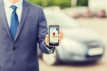 close up of business man with smartphone navigator