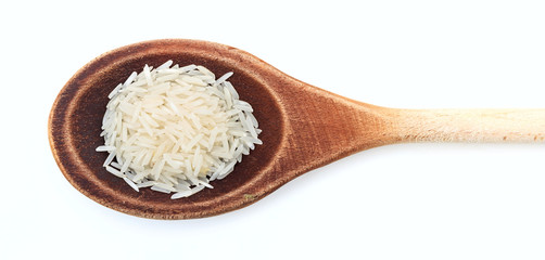 Raw basmati rice in a wooden spoon