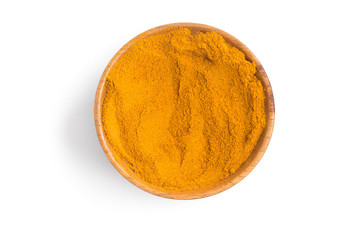 Turmeric powder into a bowl in white background