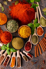 Obraz na płótnie Canvas Variety of spices on kitchen table
