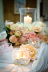 Candle with Flowers on Bridal Table Wedding Theme