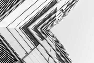 Urban Geometry, looking up to building. Modern architecture black and white, concrete and glass. ...
