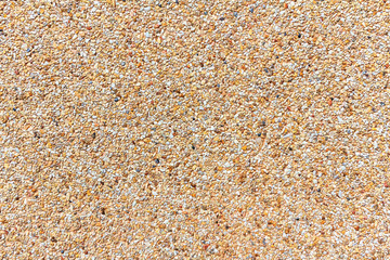 Small sand stone of sand wall texture or sand wall background. Natural brown sand stone for design with copy space for text or image.