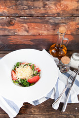 Tomato salad with basil, cheese, olive oil and garlic dressing,