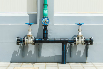 Closeup pipes and faucet valves of gas heating system in a boiler room