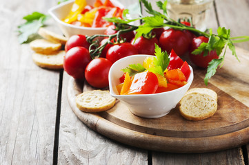 Italian sweet-sour paprika with bread and tomato