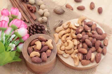 Almonds and cashew is delicious on wood background.