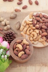 Almonds and cashew is delicious on wood background.