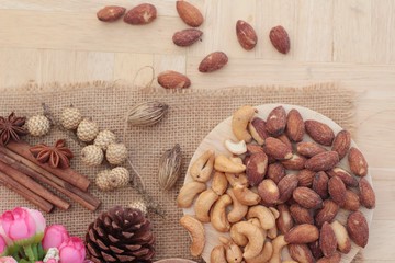 Almonds and cashew is delicious on wood background.
