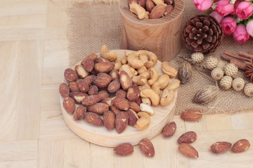 Almonds and cashew is delicious on wood background.