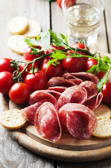 Fresh salami with tomato and bread