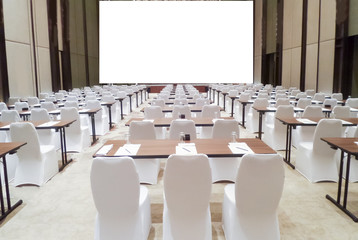 saminar meeting room with row of chair blank screen projector for adding message