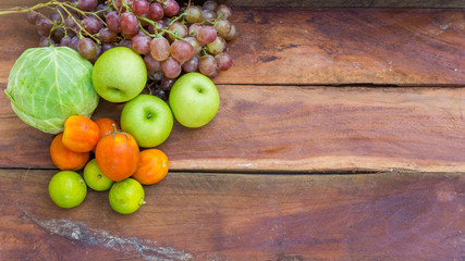fruits and vegetables on wooden background