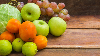 fruits and vegetables on wooden background