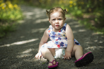 Little girl in the forest park