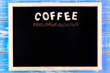 Wooden english alphabet coffee and coffee bean on the blackboard