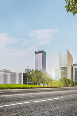 city empty traffic road with cityscape in background