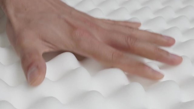 Close-up surface inspecting of memory foam peak and valley mattress 4K 2160p 30fps UltraHD video - Orthopedic exaggerated checking design elasticity with pressing tilting 4K 3840X2160 UHD footage