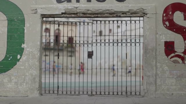 children play football in cuba