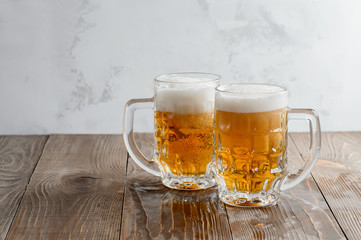 Two Oktoberfest beers on a wooden table