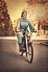 Retro picture of a woman on a motorcycle